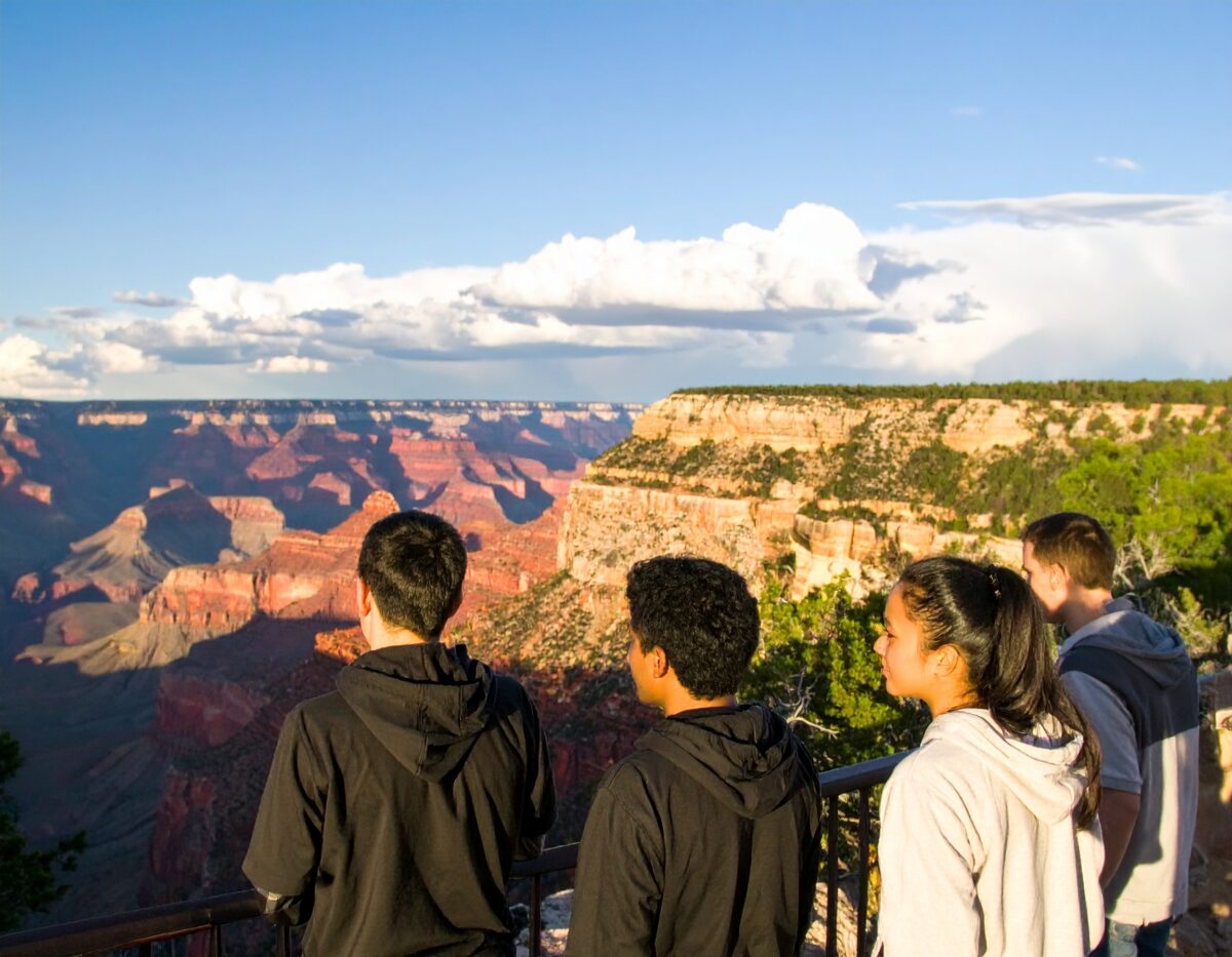 Firefly_young people looking at the view from the north rim of the Grand Canyon 959017